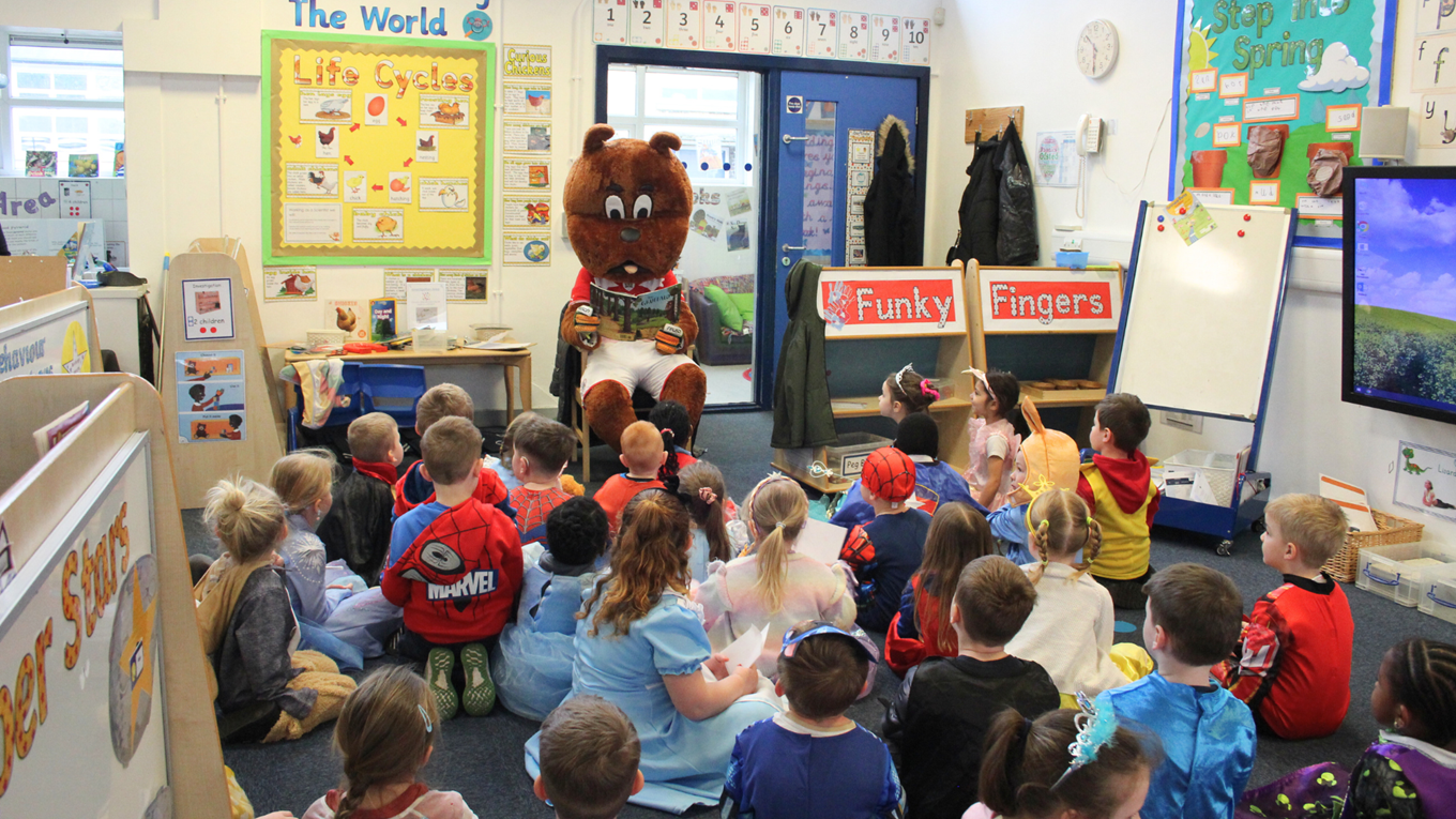 Toby Tyke reads to school children on World Book Day